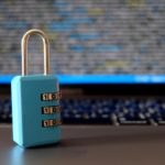 Computer security concept with a closed padlock on the laptop.