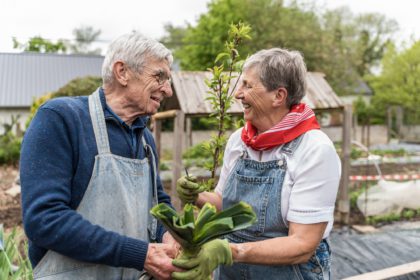 Long-term Couple Working in the Garden with Love