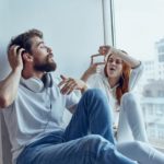Man and woman sitting on the windowsill love Lifestyle